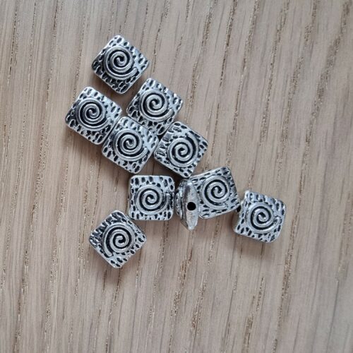 Perle acier motif spirale
