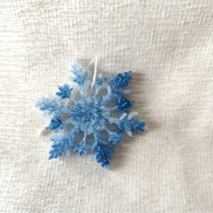 Givrelia blanc paillettes bleues