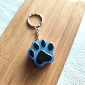 Porte clé "Pawpop" bleu caméléon