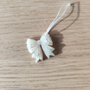 Nœud du bonheur blanc paillettes dorées