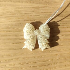 Nœud du bonheur blanc paillettes dorées