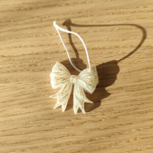 Nœud du bonheur blanc paillettes dorées